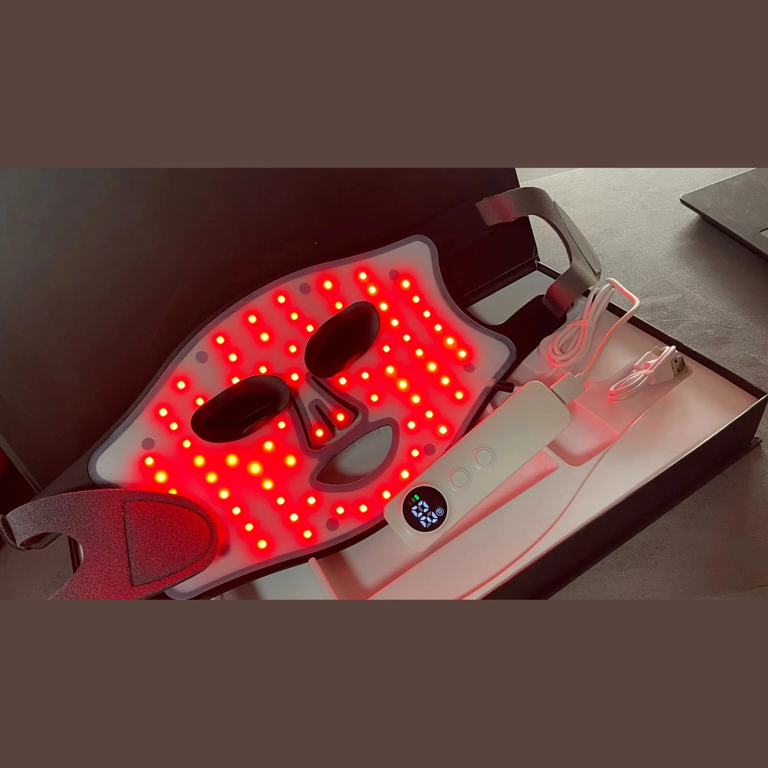 Woman preparing infrared therapy device at home