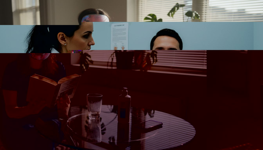 Woman using LED phototherapy mask at home